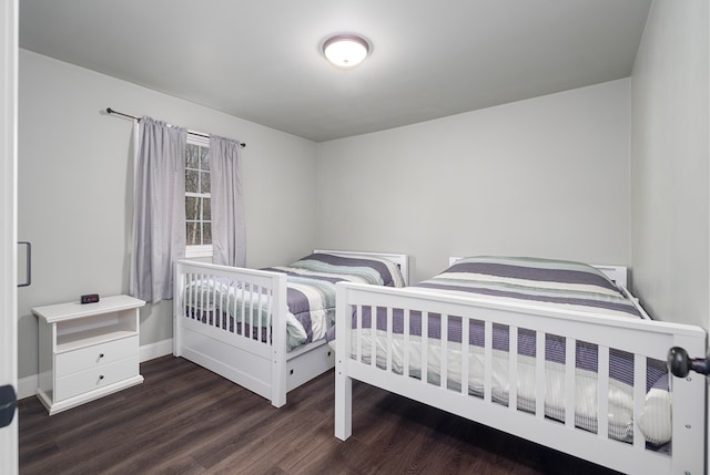 bedroom featuring dark hardwood / wood-style flooring