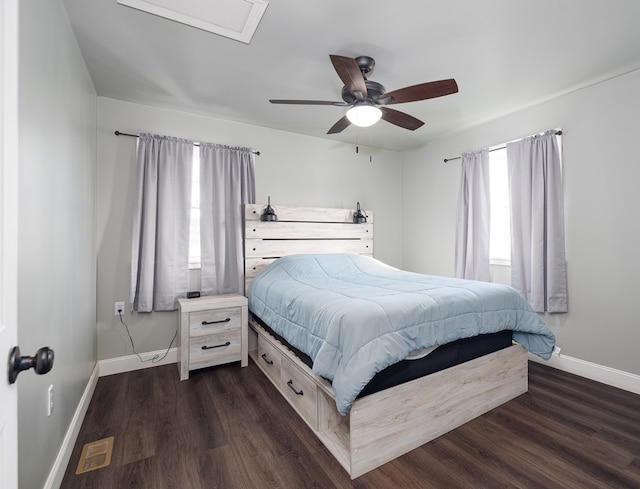 bedroom with ceiling fan and dark wood-type flooring