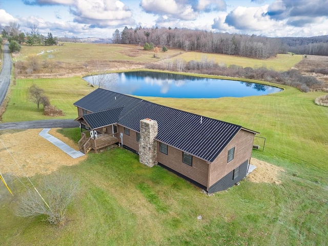 drone / aerial view featuring a rural view and a water view