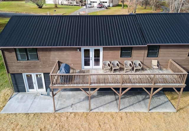 back of house with french doors and a deck