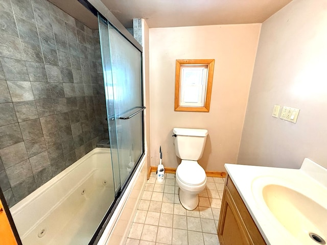 full bathroom with tile patterned floors, vanity, toilet, and combined bath / shower with glass door