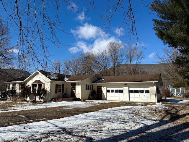 ranch-style home featuring a garage