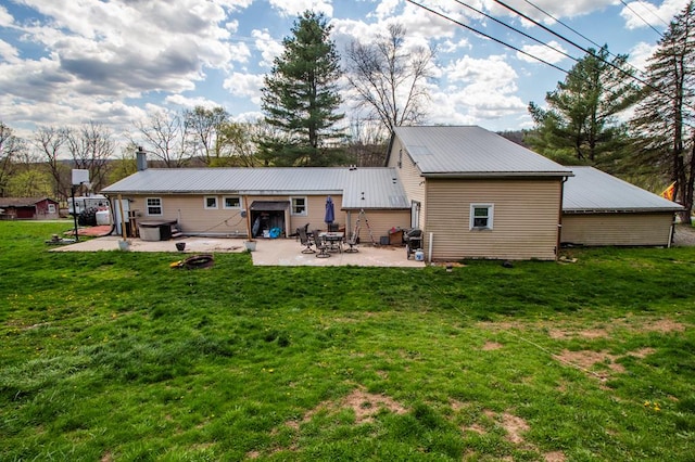 145 Tracy Brewer Rd, Meshoppen, PA 18630 - rear view of house with a patio, metal roof, a yard, and a chimney