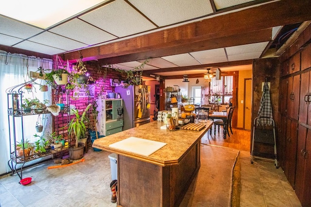 145 Tracy Brewer Rd, Meshoppen, PA 18630 - kitchen with freestanding refrigerator, a center island, a drop ceiling, and ceiling fan