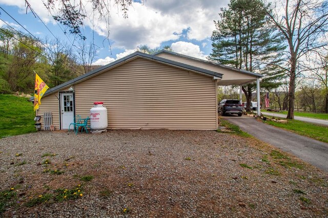 145 Tracy Brewer Rd, Meshoppen, PA 18630 - view of side of property with a carport and driveway