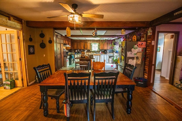 145 Tracy Brewer Rd, Meshoppen, PA 18630 - dining area with wood finished floors, beam ceiling, and ceiling fan