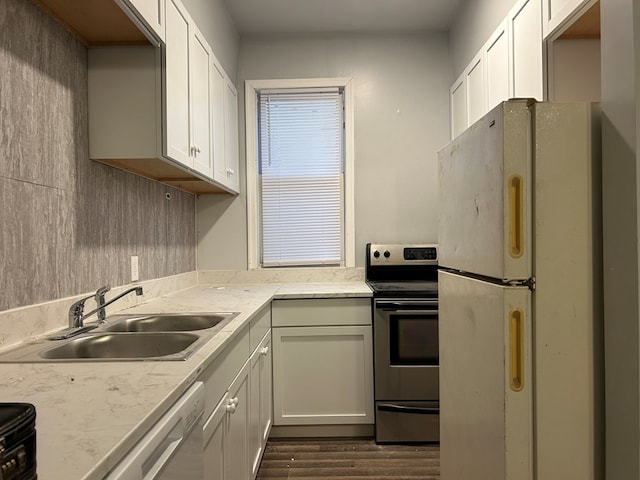 kitchen with white cabinetry, stainless steel appliances, and sink