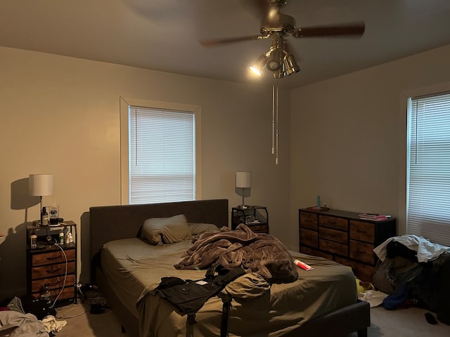 carpeted bedroom with ceiling fan