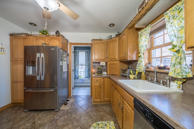 208 S St, Athens, PA 18810 - kitchen featuring brown cabinetry, a ceiling fan, a sink, and stainless steel appliances