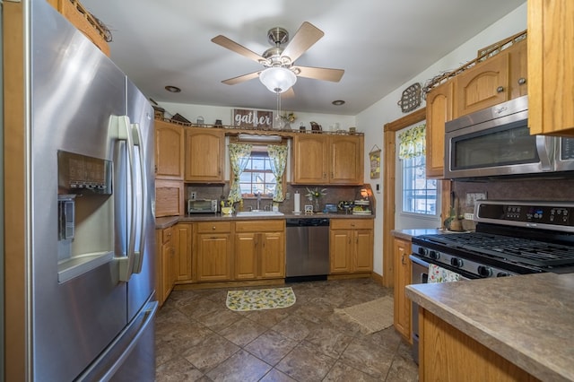 208 S St, Athens, PA 18810 - kitchen with tasteful backsplash, a sink, appliances with stainless steel finishes, ceiling fan, and a toaster