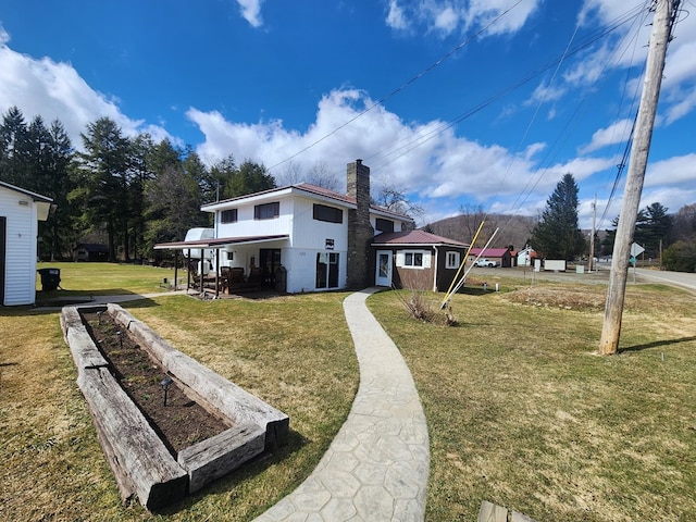 130 Cherry Springs Rd, Coudersport, PA 16915 - back of property with a yard and a chimney