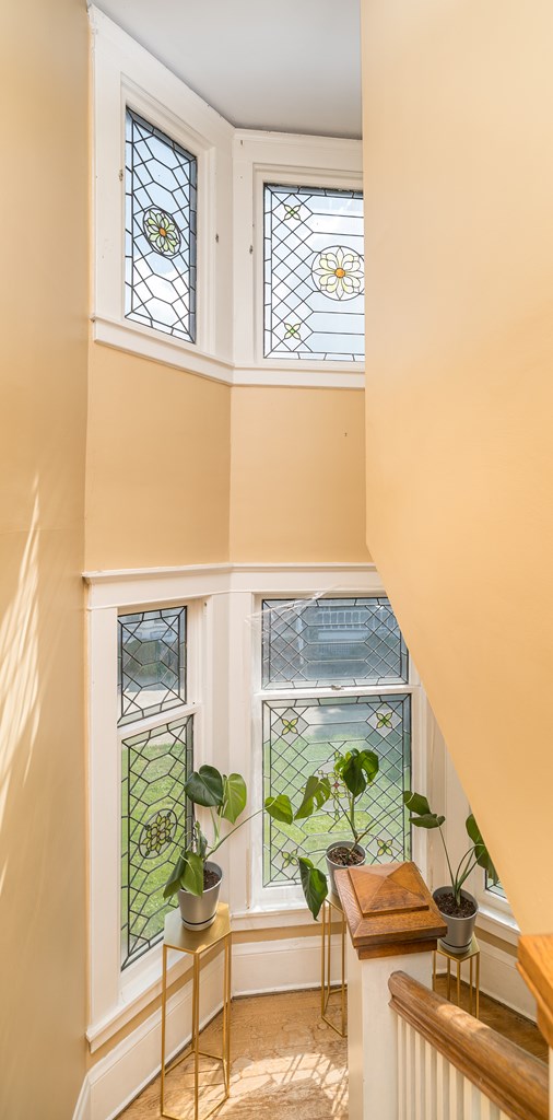 sitting room featuring a towering ceiling