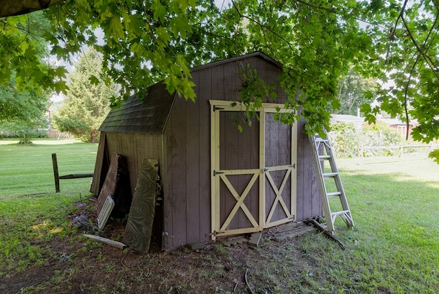 view of outdoor structure featuring a lawn