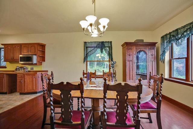 dining room featuring a chandelier and hardwood / wood-style floors