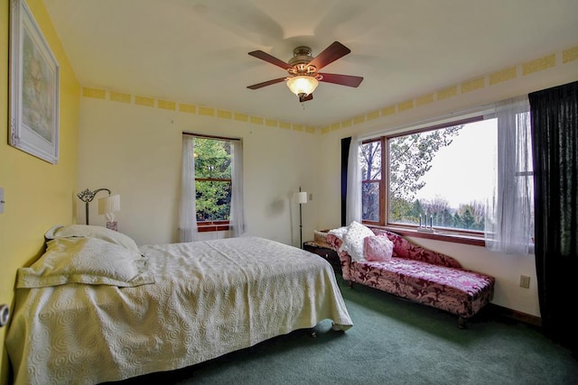 carpeted bedroom with ceiling fan