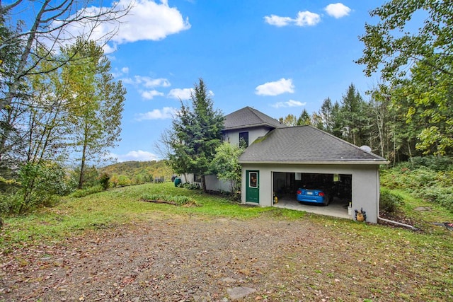 view of side of property featuring a garage