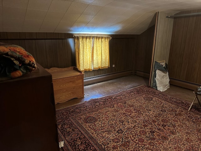 bedroom with wood walls and baseboard heating