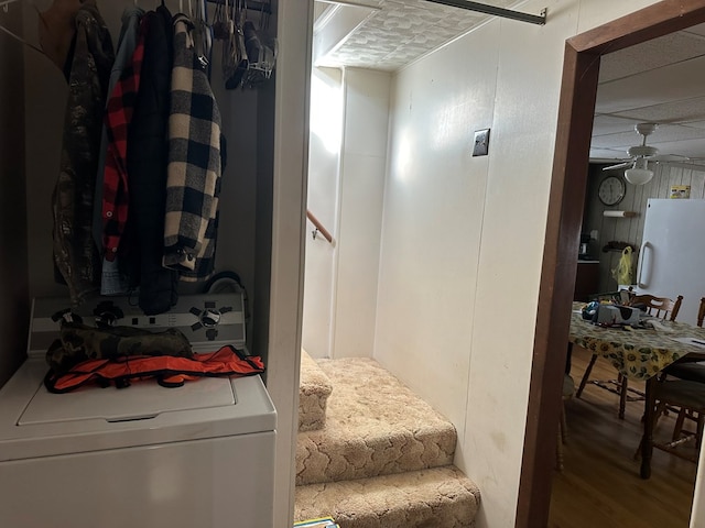 interior space with washer / dryer, hardwood / wood-style flooring, and ceiling fan