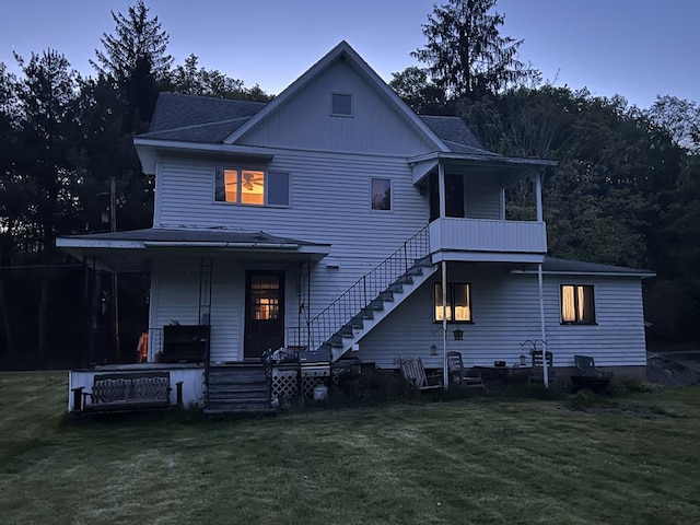 213 2nd St, Harrison Valley, PA 16927 - back of house with a porch, a yard, stairway, and a shingled roof