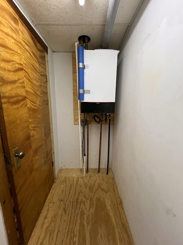 213 2nd St, Harrison Valley, PA 16927 - corridor featuring water heater
