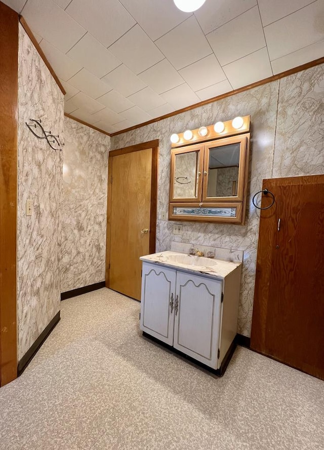 213 2nd St, Harrison Valley, PA 16927 - bathroom with crown molding, vanity, and carpet floors