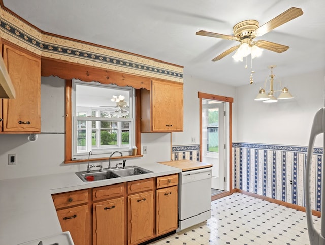 113 Hemlock Rd, Sayre, PA 18840 - kitchen with dishwasher, a sink, light countertops, wallpapered walls, and light floors