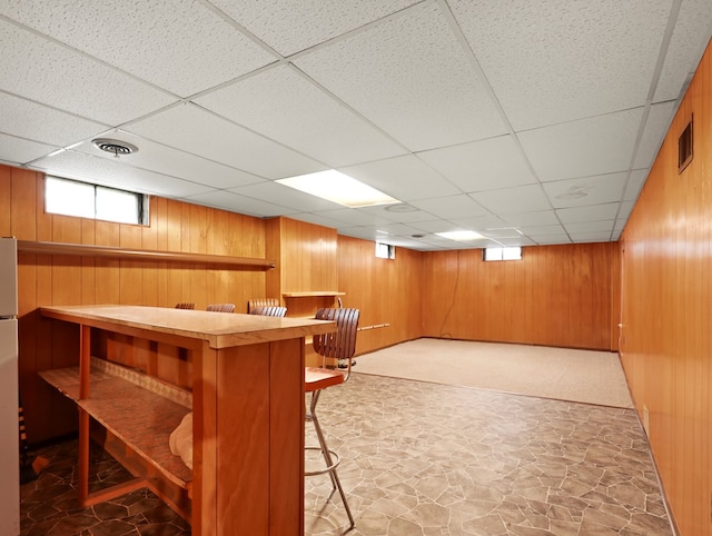 113 Hemlock Rd, Sayre, PA 18840 - bar featuring stone flooring, a drop ceiling, and wood walls
