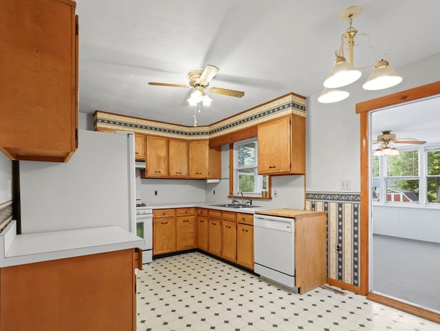 113 Hemlock Rd, Sayre, PA 18840 - kitchen featuring white appliances, ceiling fan, a sink, and light countertops
