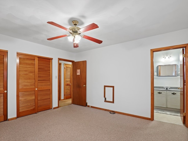 113 Hemlock Rd, Sayre, PA 18840 - unfurnished bedroom featuring two closets, carpet, connected bathroom, and baseboards