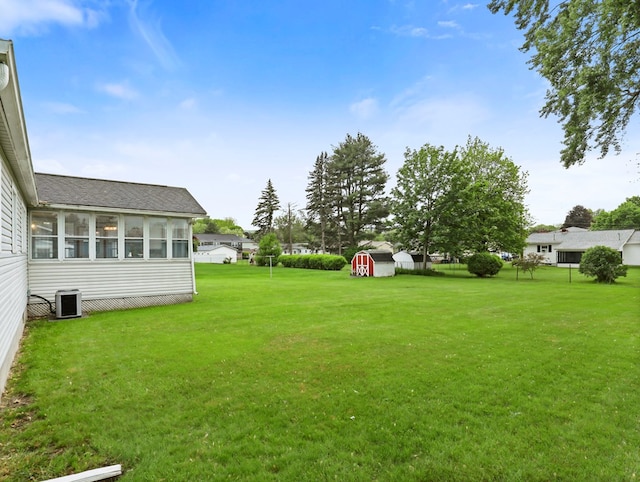 113 Hemlock Rd, Sayre, PA 18840 - view of green lawn with a sunroom and central AC unit