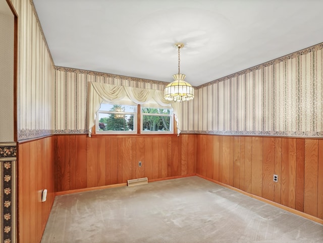 113 Hemlock Rd, Sayre, PA 18840 - unfurnished room featuring wainscoting, a chandelier, wallpapered walls, wooden walls, and carpet flooring