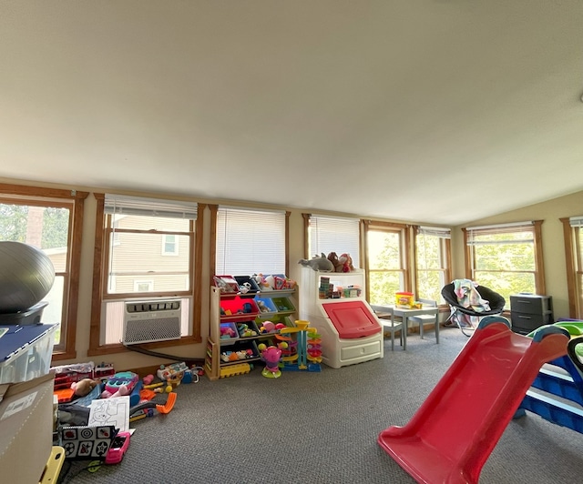 game room with carpet floors, cooling unit, and lofted ceiling