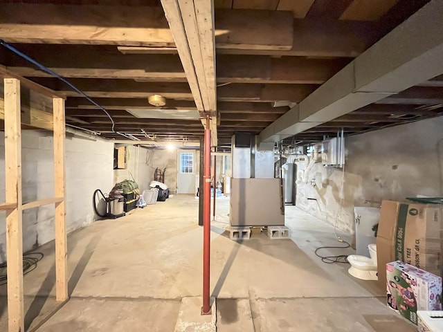 basement with heating unit and water heater