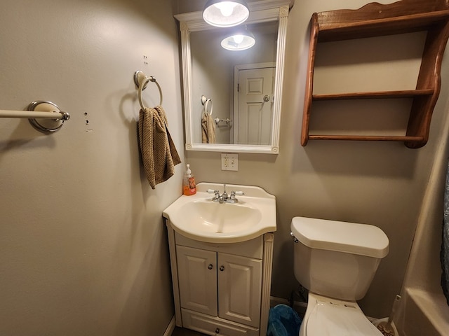 half bath featuring toilet and vanity