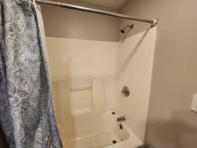 bathroom featuring shower / tub combo with curtain