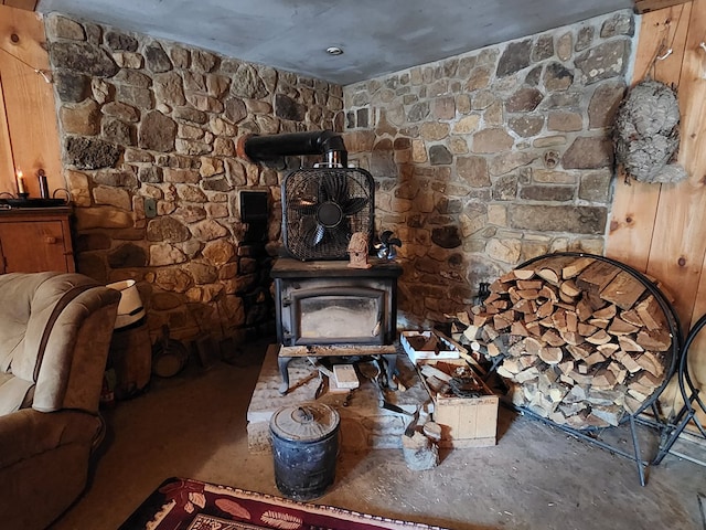 living area featuring a wood stove