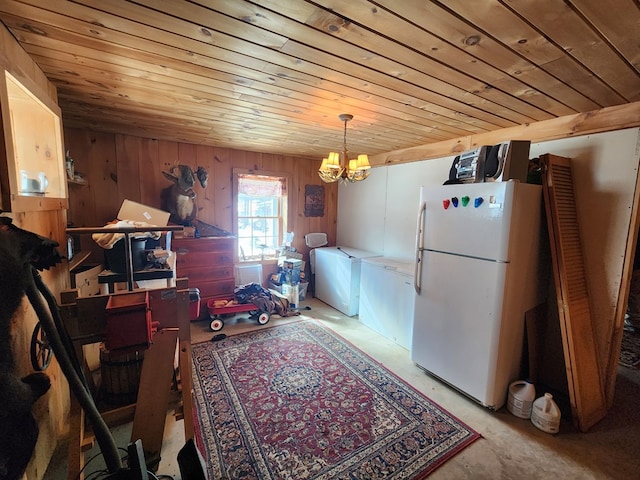 interior space featuring a chandelier, wood ceiling, and wooden walls