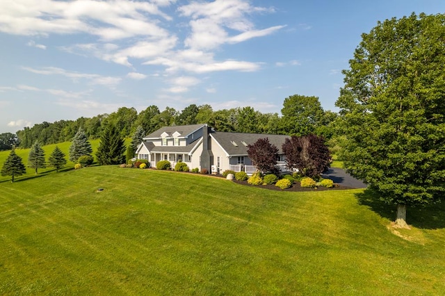 exterior space with a front lawn and a rural view