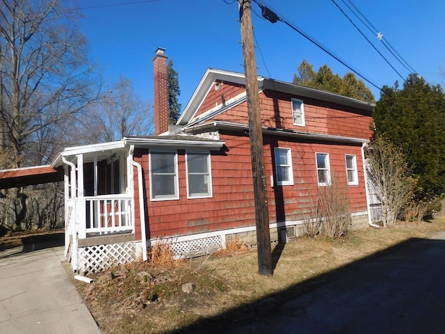 view of property exterior featuring a chimney