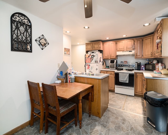 kitchen with ceiling fan, sink, white appliances, and kitchen peninsula