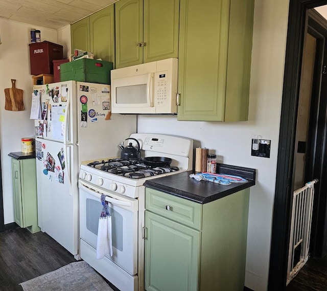 kitchen featuring dark wood-style floors, white appliances, dark countertops, and green cabinetry