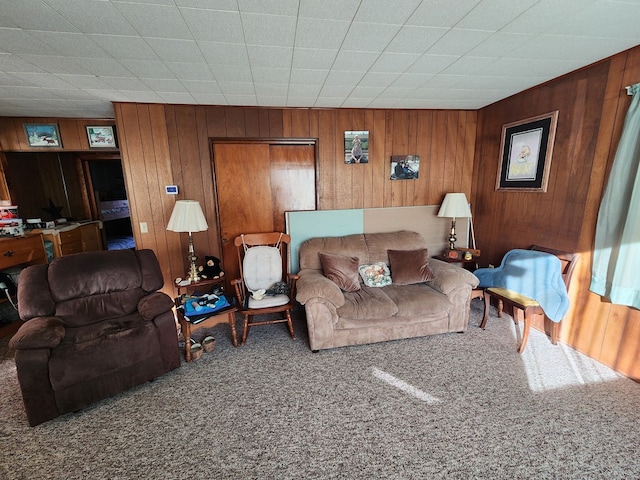 living room with carpet flooring and wooden walls