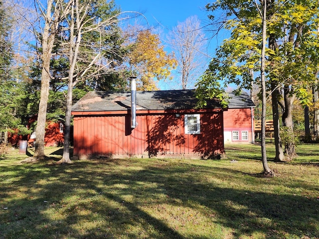 view of property exterior with a yard