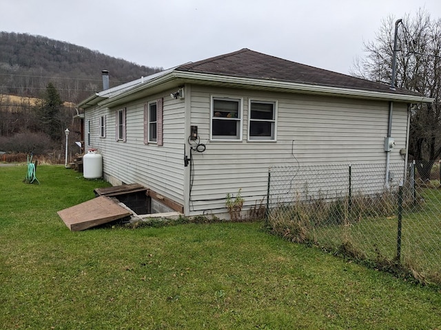 view of home's exterior with a yard