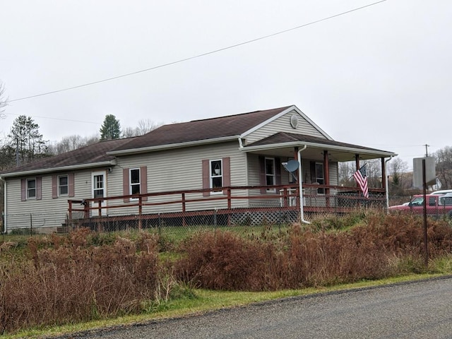 view of front of home with a porch and a deck