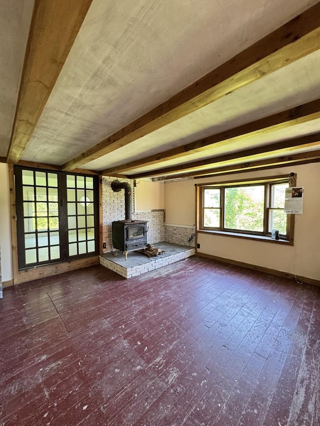 971 Indian Creek Rd, Eldred, PA 16731 - unfurnished living room featuring a wood stove and beamed ceiling