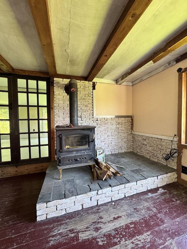 971 Indian Creek Rd, Eldred, PA 16731 - detailed view of a wood stove, beam ceiling, wood finished floors, and wainscoting