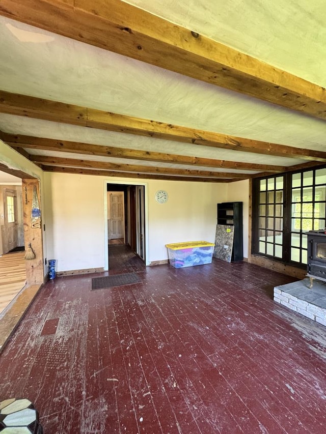 971 Indian Creek Rd, Eldred, PA 16731 - unfurnished living room featuring a wood stove, beamed ceiling, and wood-type flooring
