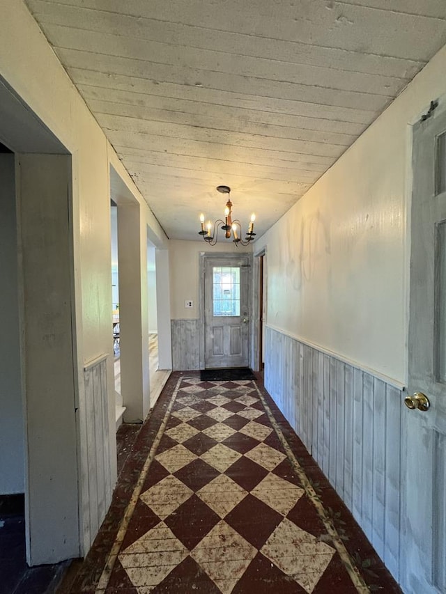 971 Indian Creek Rd, Eldred, PA 16731 - hall featuring a chandelier and wainscoting