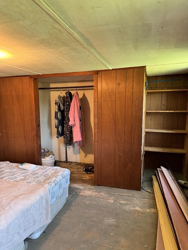 971 Indian Creek Rd, Eldred, PA 16731 - bedroom with wood walls and unfinished concrete flooring